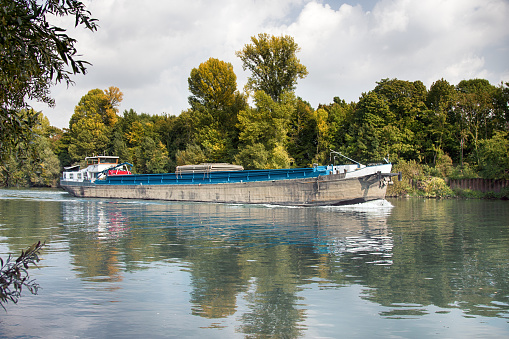 Barge on Seine. cargo ships floating on river