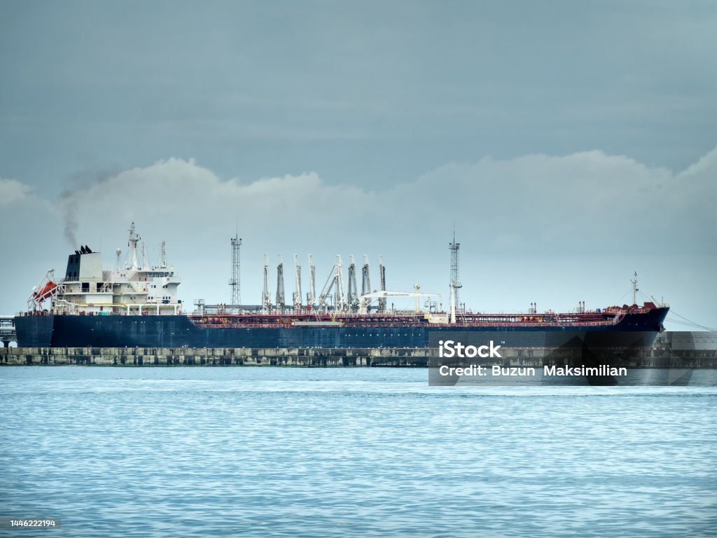 Oil vessel during filling with oil products Oil vessel during filling with oil products. Rosneft oil company Black Sea Stock Photo