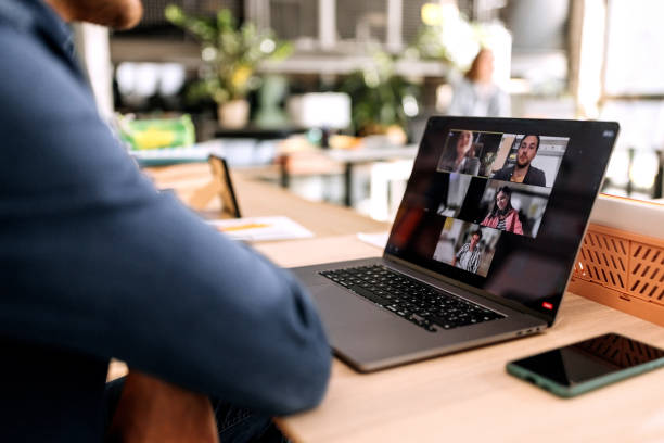 Close up of businessman having online meeting in the office Close up of businessman having online meeting in the office web conference stock pictures, royalty-free photos & images