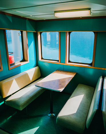 Colourful interior of  vintage ferry though Norwegian fjord  shot on film