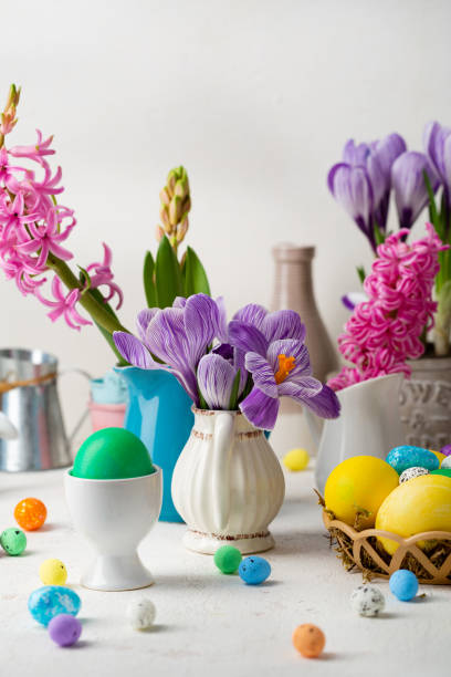 Spring Easter composition with flowers and eggs stock photo