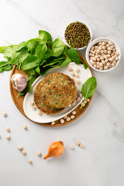 vegan chick pea pancakes on wooden plate healthy food - cooked vertical high angle view lentil imagens e fotografias de stock