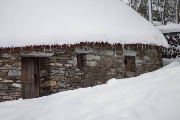 istock Traditional construction (palloza) covered by snow in O Cebreiro. 1446228314