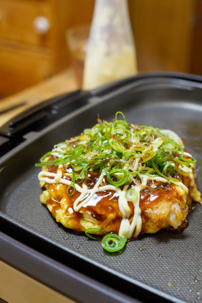 istock Japanese okonomiyaki on hot plate 1446232053