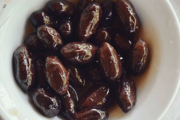 istock Black olives served in white bowl 1446234338