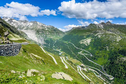 View from the Grimsel pass to the Furka pass road and the village of Gletsch located in the upper Rhone valley.