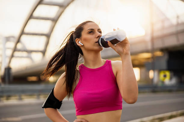 istock Female athlete drinking water 1446235647