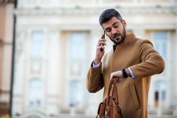 istock Attractive businessman using smart phone 1446236957