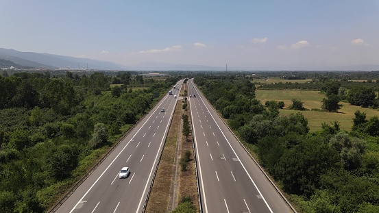 Aerial view of asphalt road with rural area on both sides. Intercity High Traffic at Turkey City Aerial Drone Shoting High Quality