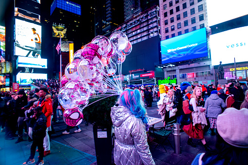 New York City, New York, United States - November 26, 2020 : balloon seller walking on the times square