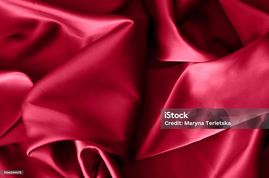 Fabric background in burgundy color. Color of 2023. Viva. Magenta. Clothing Stock Photo