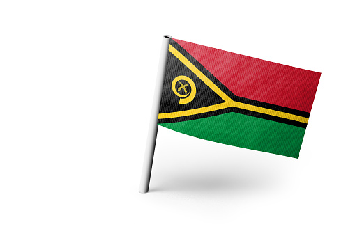 Small paper flag of Vanuatu pinned. Isolated on white background. Horizontal orientation. Close up photography. Copy space.