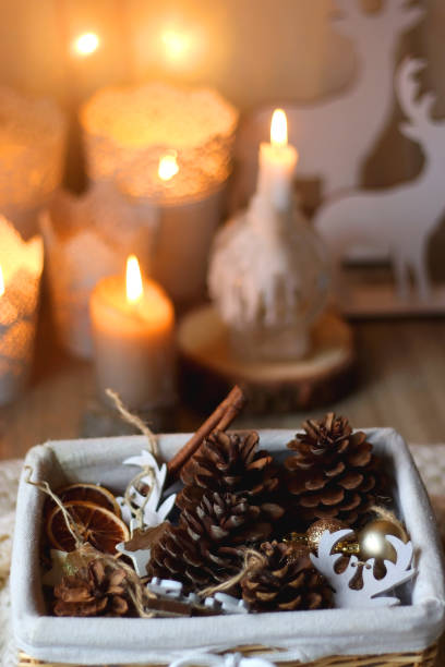 istock Pine Cones, Christmas Decorations and Candles 1446247003