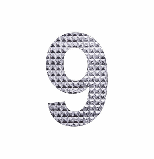 istock Number 9 - Digit nine in textured silver shiny paper 1446249992