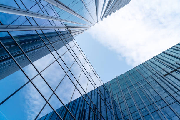 istock Looking up at modern abstract glass building 1446255121