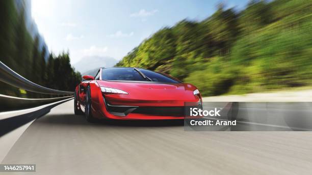 Red Sports Car Driving On A Mountain Road Stock Photo - Download Image Now - Sports Car, Car, Speed