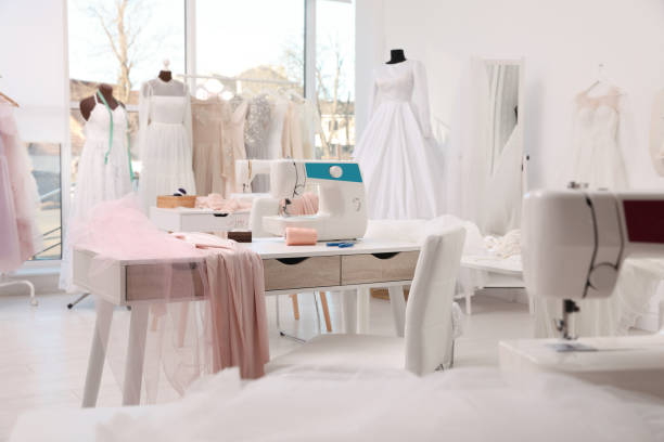 istock Dressmaking workshop interior with wedding dresses and equipment 1446262354