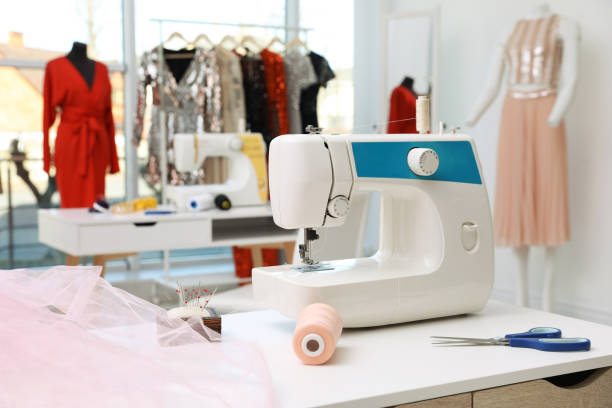 istock Sewing machine and equipment on table in dressmaking workshop 1446263427