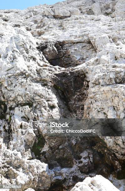 Spring Water That Flows Between The Rocks Of The European Alps During The Thawing Of The Glaciers Stock Photo - Download Image Now