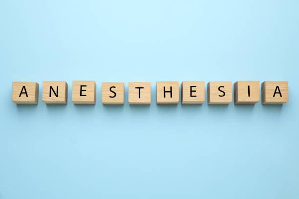 istock Wooden cubes with word Anesthesia on light blue background, top view 1446264200