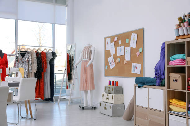 istock Dressmaking workshop interior with stylish female clothes and equipment 1446264820