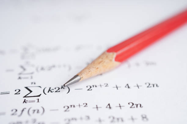 istock Pencil on mathematic formula exercise test paper in education school. 1446268504