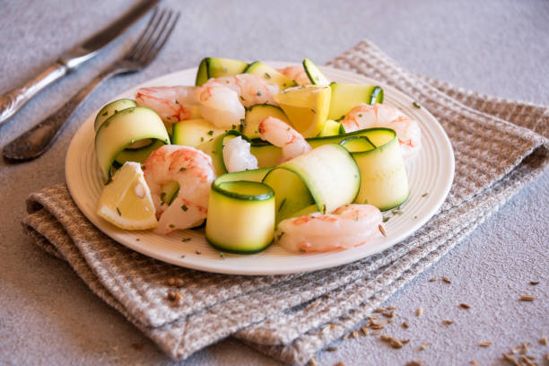 Fresh zucchini with shrimps, healthy and delicious food Fresh zucchini with shrimps, healthy delicious food seafood salad stock pictures, royalty-free photos & images