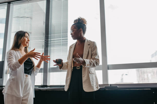 istock young employees talking to the company where they work 1446269710