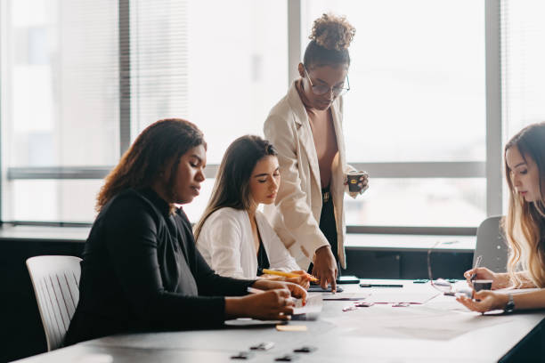 istock woman mentoring coworker 1446269774