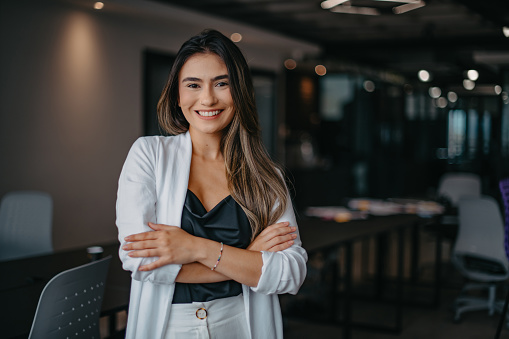 relaxed portrait of young woman inside the company