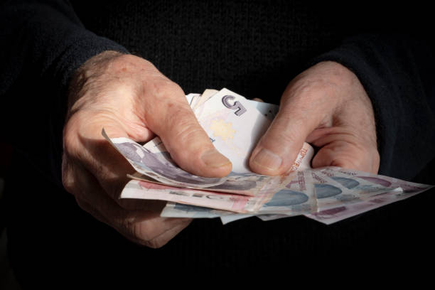 istock Man Giving Turkish Currency 1446272480