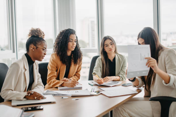 istock analyzing report in business meeting between women 1446273567