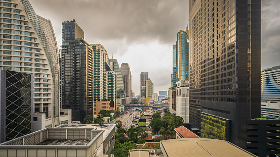 Bangkok City skyline view of Asoke intersection, Asoke Montri Road, Sukhumvit business district cityscape at daytime, High angle view BTS sky train city transport, Thailand