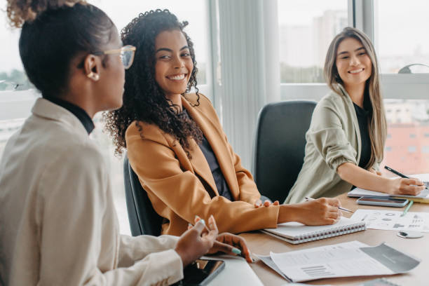 istock casual conversation between women during business meeting 1446273663