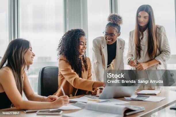 Women Engaged In Solving Problems Stock Photo - Download Image Now - Women, Only Women, Working