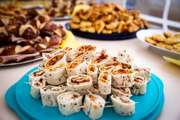 a buffet with pancake slices, filled with vegetables, concept catering or party finger food