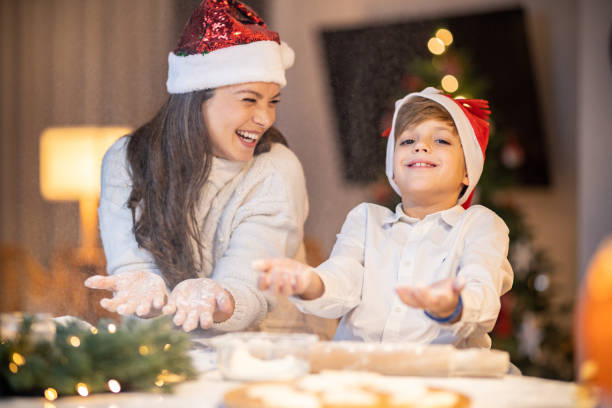 istock Mother and son prepairing christmas cookies 1446275514