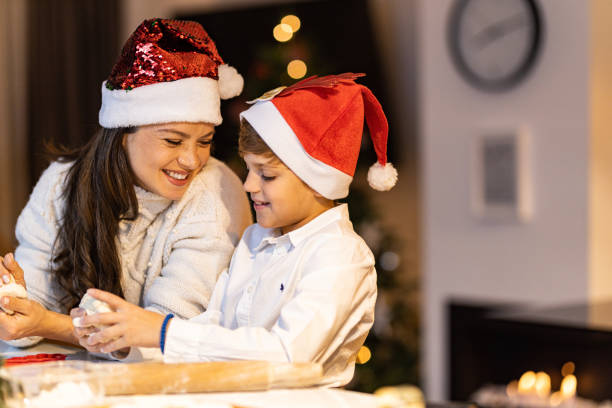 istock Mother and son prepairing christmas cookies 1446278056