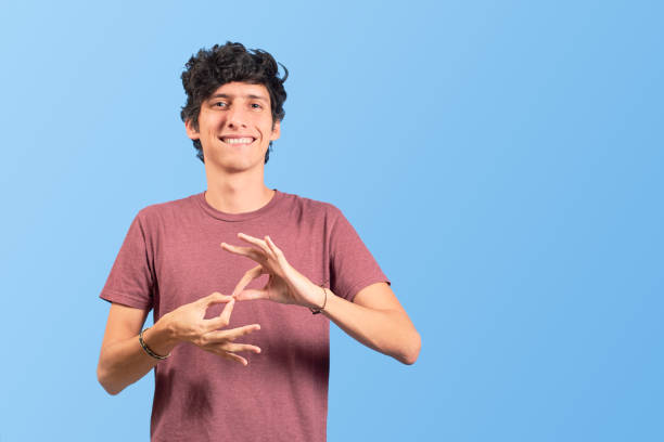 young man doing sign language, in flat lay. - sign language imagens e fotografias de stock