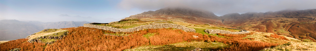 Panoramic view of Roman fort ruins. Remains of roman wall at Hardknott Pass, Lake District, UK