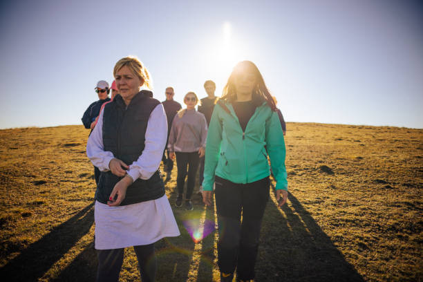 istock Active group of Caucasian people, hiking during sunny autumn day 1446281966