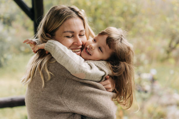 istock Tender mother hugging her little daughter. 1446282799