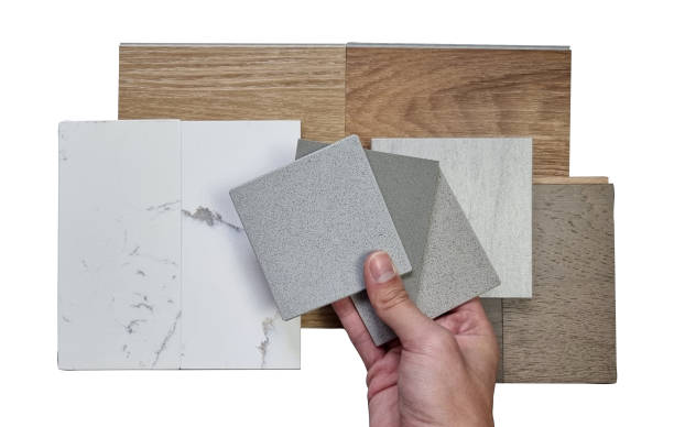 istock interior designer picking material samples including vinyl flooring tiles, marble quartzs, engineering flooring tiles, stone tile, artificial stones isolated on white background with clipping path. 1446283945