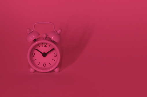 Viva magenta color of the year 2023. Alarm clock.