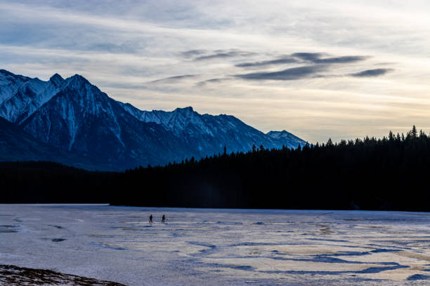 istock Skaters on Johnson Lake. Banff National Park, Alberta, Canada 1446287324