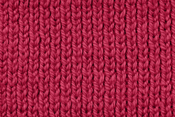 istock Texture of knitted viva magenta color background. Pattern. 1446288070