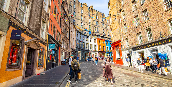 Edinburgh, Scotland - 2 September 2022: Popular tourist Victoria street in Edinburgh's old town