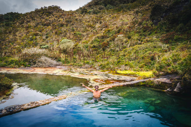 istock Young man swimming in a hot springs  water 1446291173