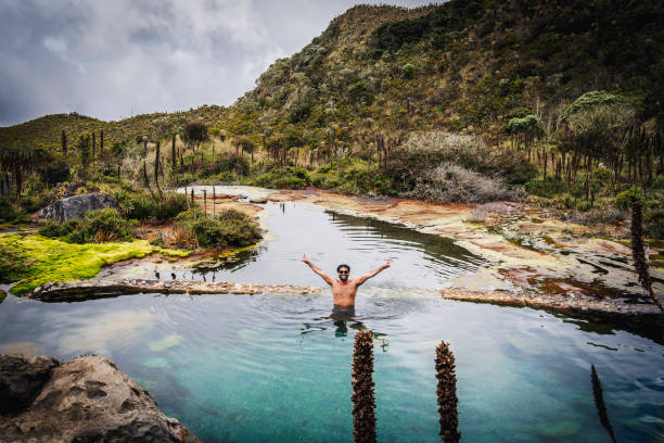 istock Young man swimming in a hot springs  water 1446291527