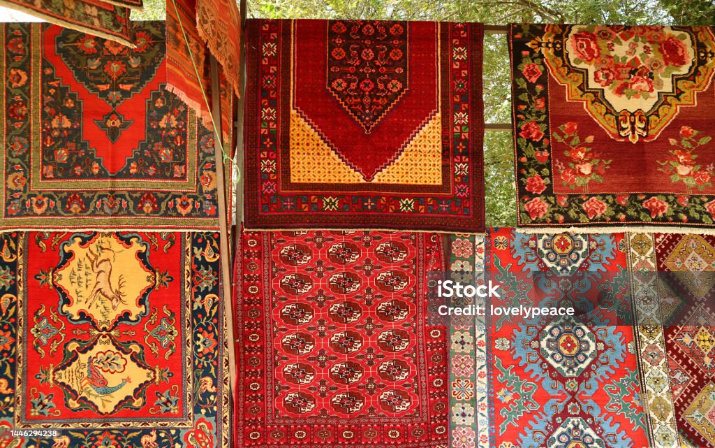 Various Patterns of Carpets at Vernissage Local Market in Downtown Yerevan, Armenia Antique Stock Photo